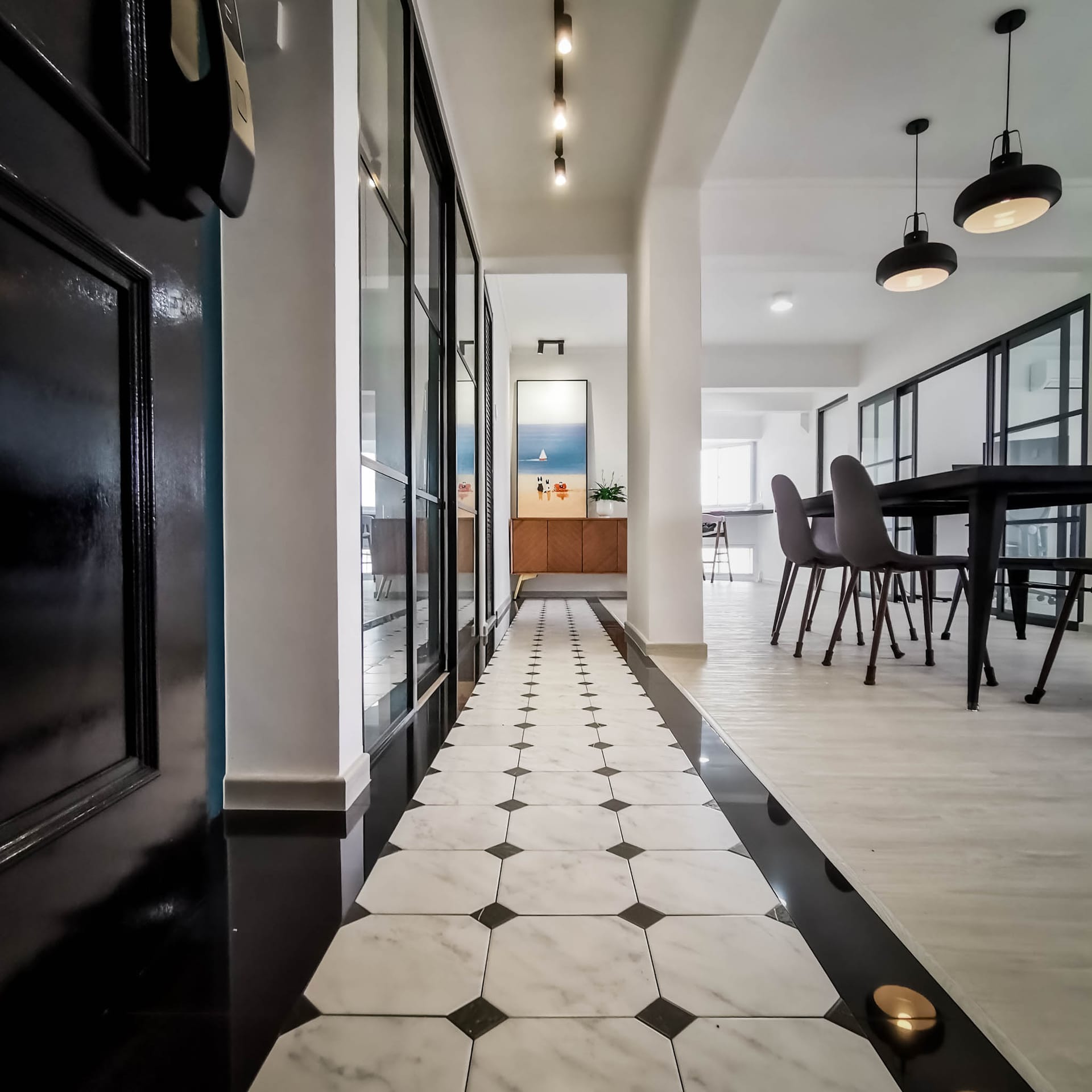 After renovation: Completed bespoke interior with seamless fluted carpentry and cove illumination
