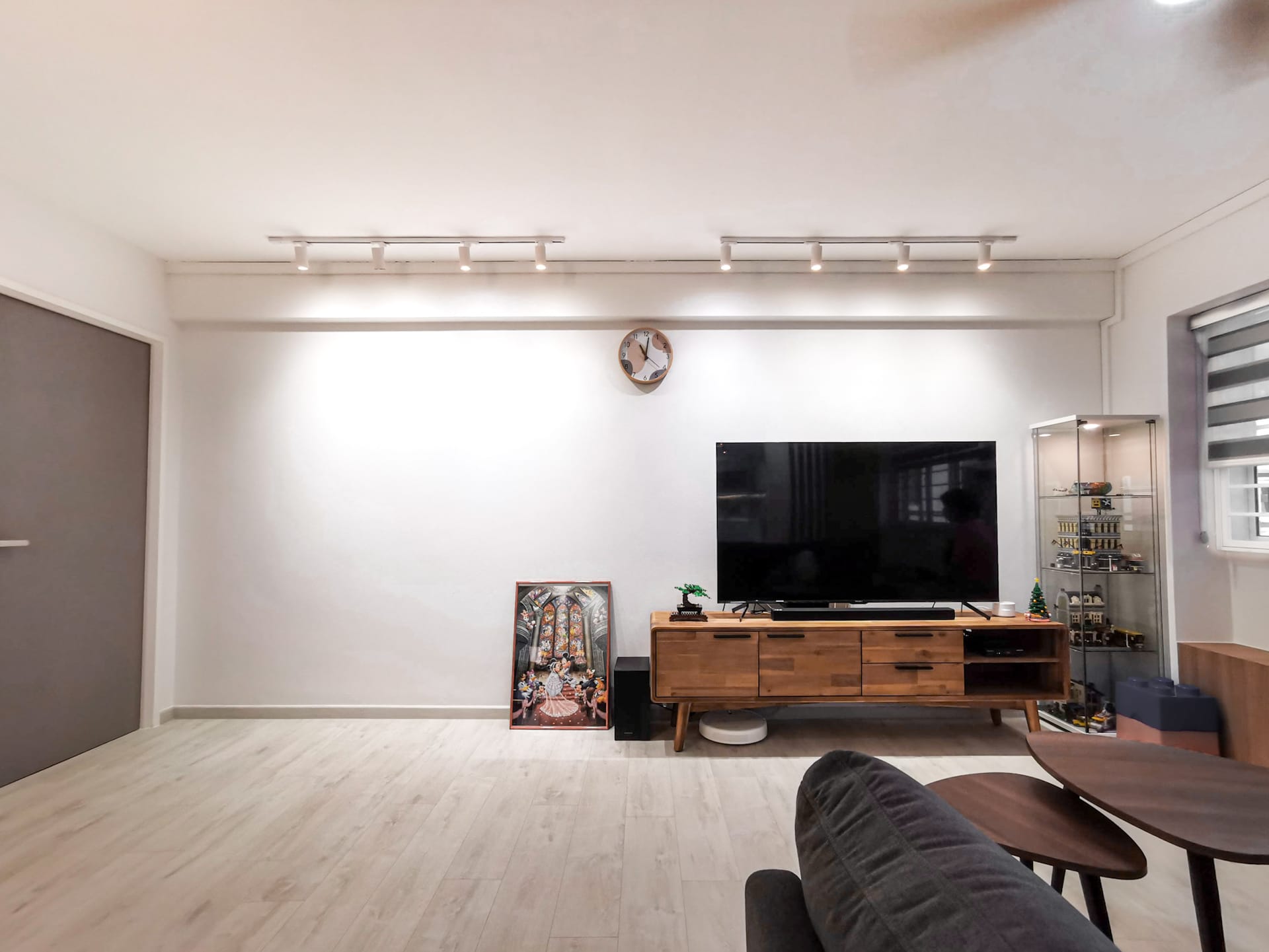 Seletar Springs condominium interior featuring warm wood veneer wall panels